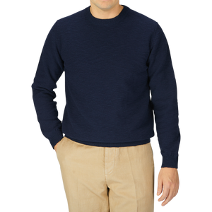 A man wearing a Maurizio Baldassari Navy Cotton Mouline Crew Neck Sweater and khaki pants.