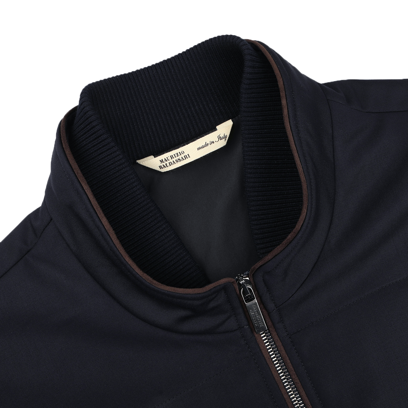 Close-up of the Maurizio Baldassari Navy Merino Wool Thermore Travel Gilet, featuring a front zipper, brown trim, and Thermore insulation. The label inside reads "Made in Italy" with black text on a white background.