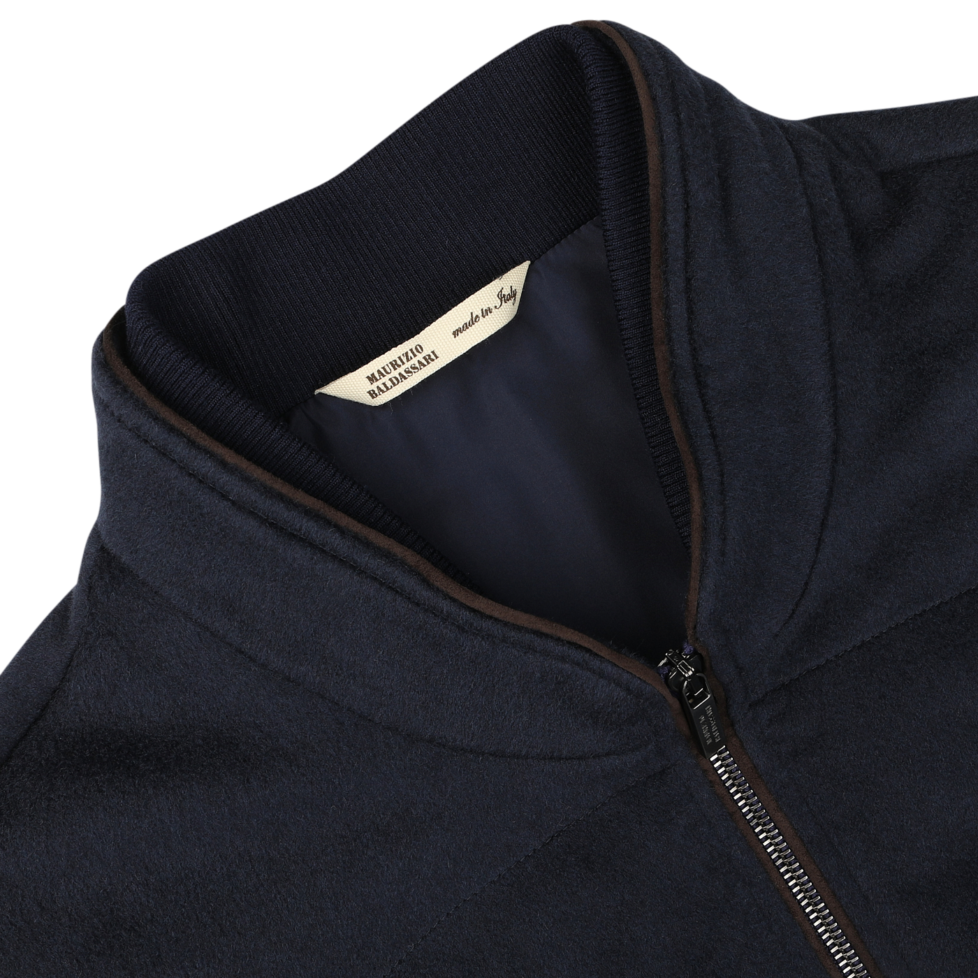 Close-up of a Maurizio Baldassari Navy Water Repellent Pure Cashmere Gilet featuring a zip-up front, with a label indicating it is made in Italy.