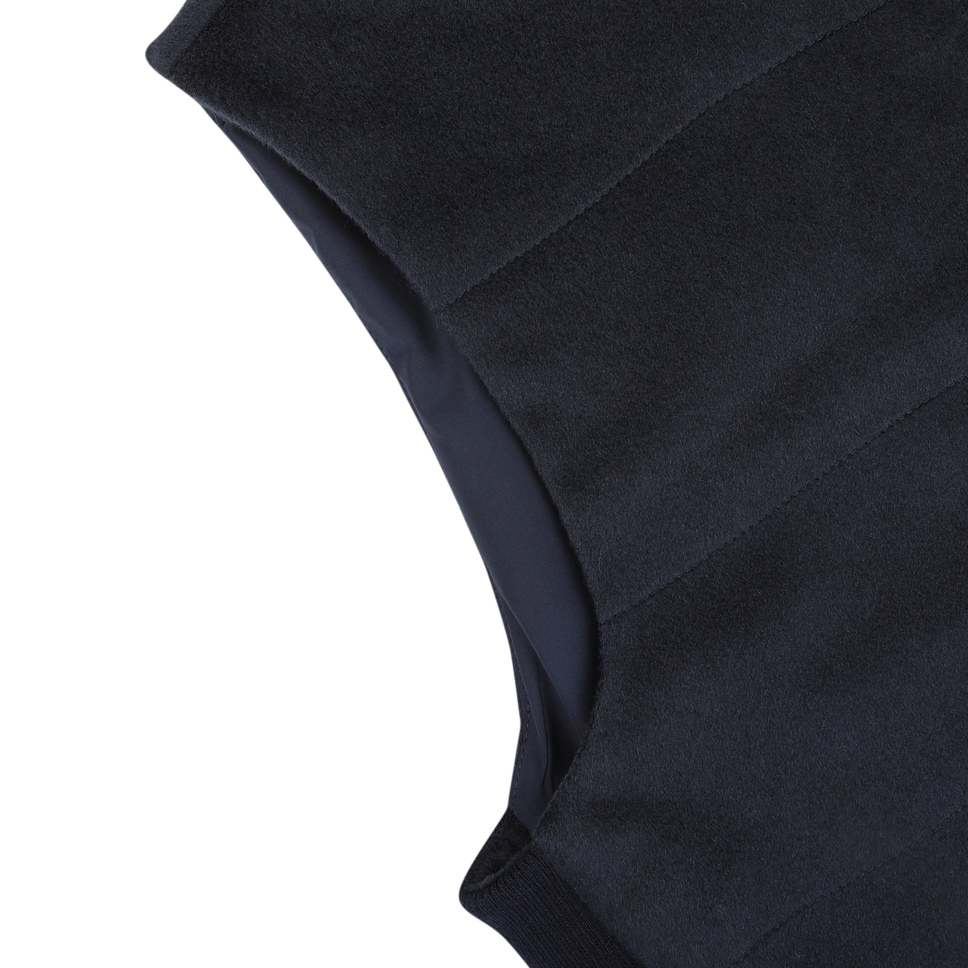 Close-up of a Navy Water Repellent Pure Cashmere Gilet by Maurizio Baldassari laying on a white surface, showcasing the seams and fabric texture.