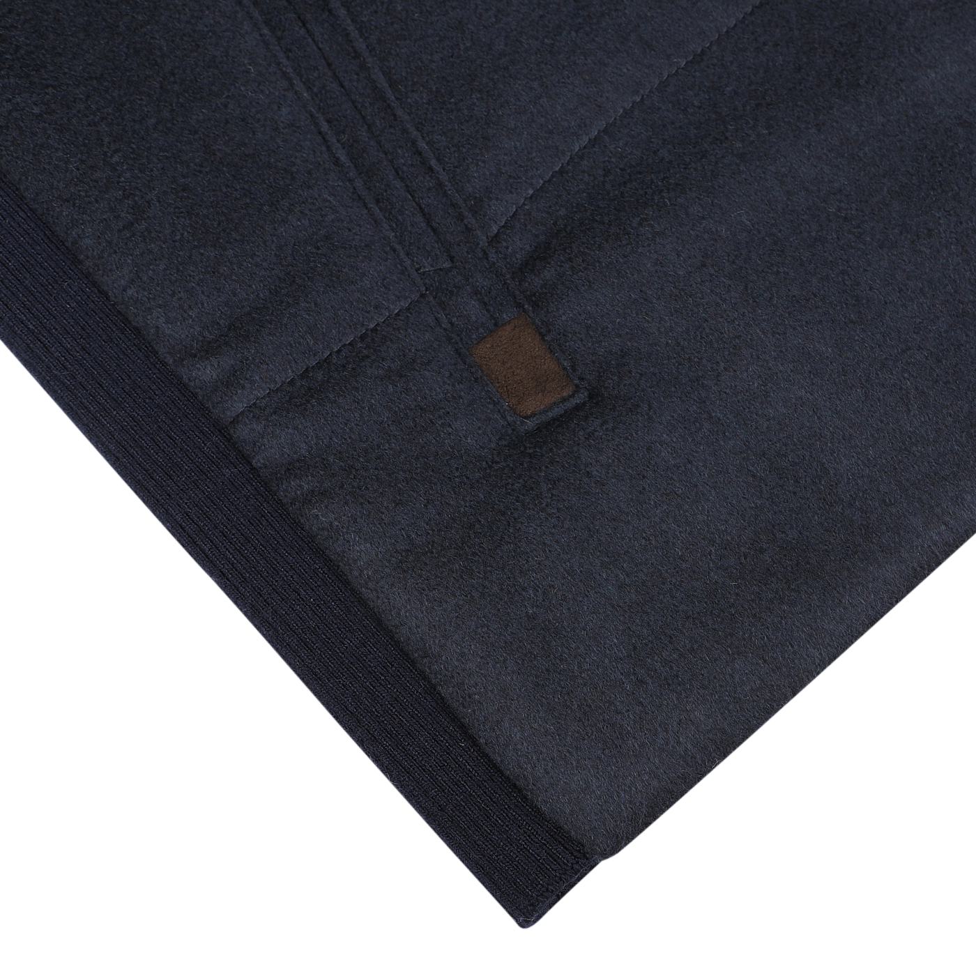 Close-up view of the Navy Water Repellent Pure Cashmere Gilet by Maurizio Baldassari, showcasing the zipper and a small brown tag, with detailed emphasis on the texture and stitching.