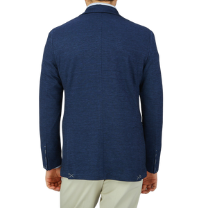 The back view of a man wearing a Maurizio Baldassari Dark Blue Wool Linen Silk Jersey Blazer.