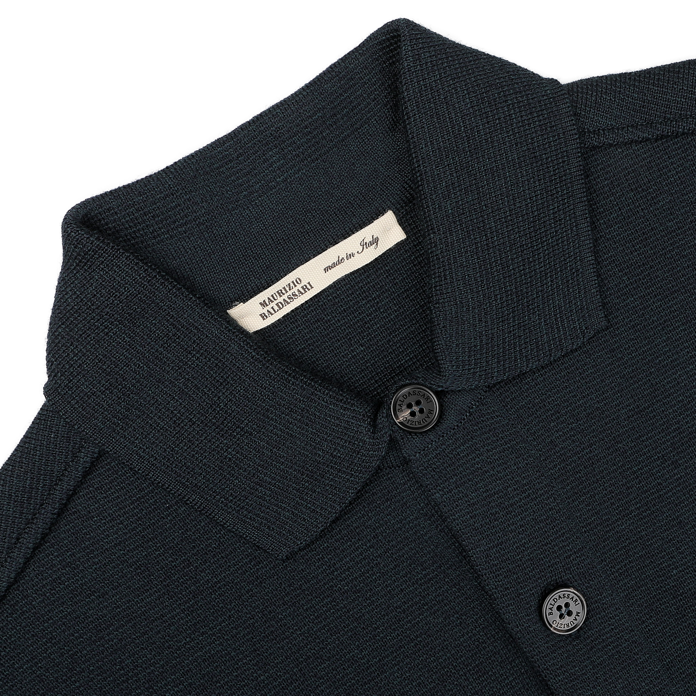 A petrol green Milano knitted wool overshirt by Maurizio Baldassari, crafted from virgin wool with two buttons, featuring a label that says "Made in Italy.