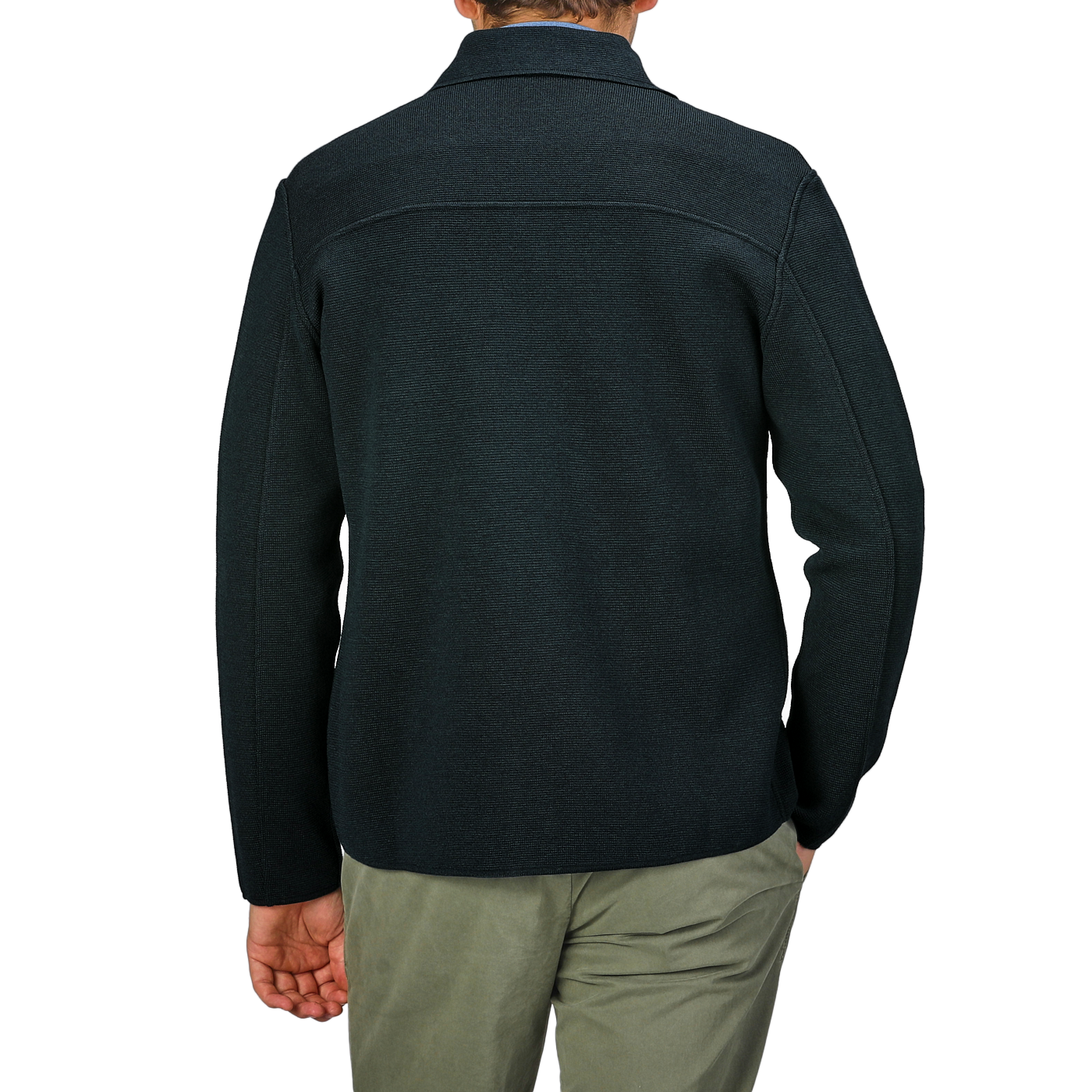 A person wearing a Maurizio Baldassari Petrol Green Milano Knitted Wool Overshirt and light pants is shown from behind against a plain background.