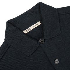 A petrol green Milano knitted wool overshirt by Maurizio Baldassari, crafted from virgin wool with two buttons, featuring a label that says "Made in Italy.