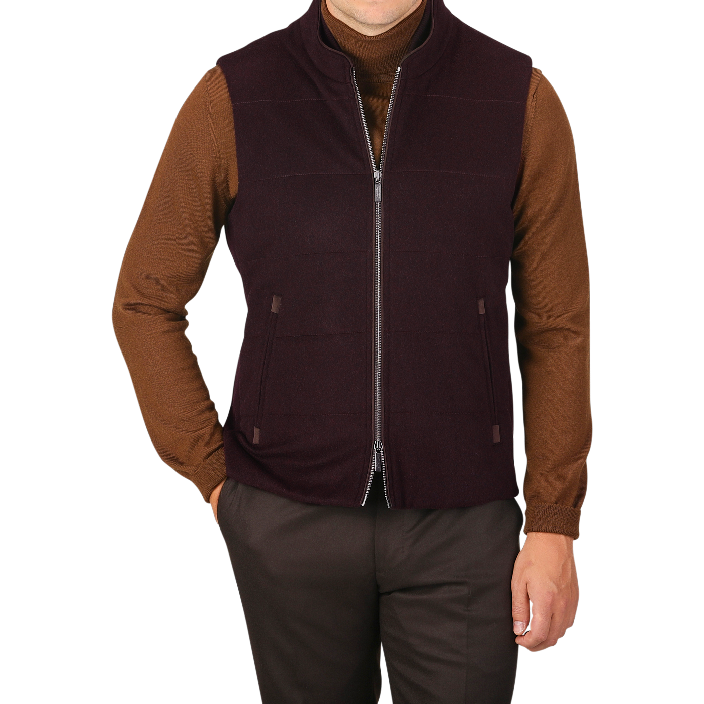 A person wearing a brown long-sleeve shirt, brown pants, and a Maurizio Baldassari Plum Water Repellent Cashmere Gilet poses against a plain background.