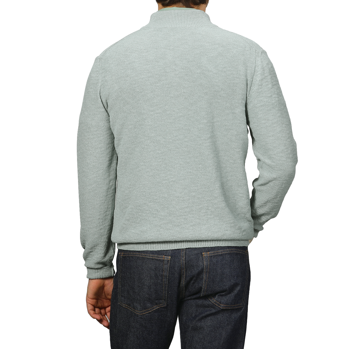 A person wearing a Maurizio Baldassari Sage Green Summer Mouline 1/4 Zip Sweater and dark jeans is shown from the back against a plain background.