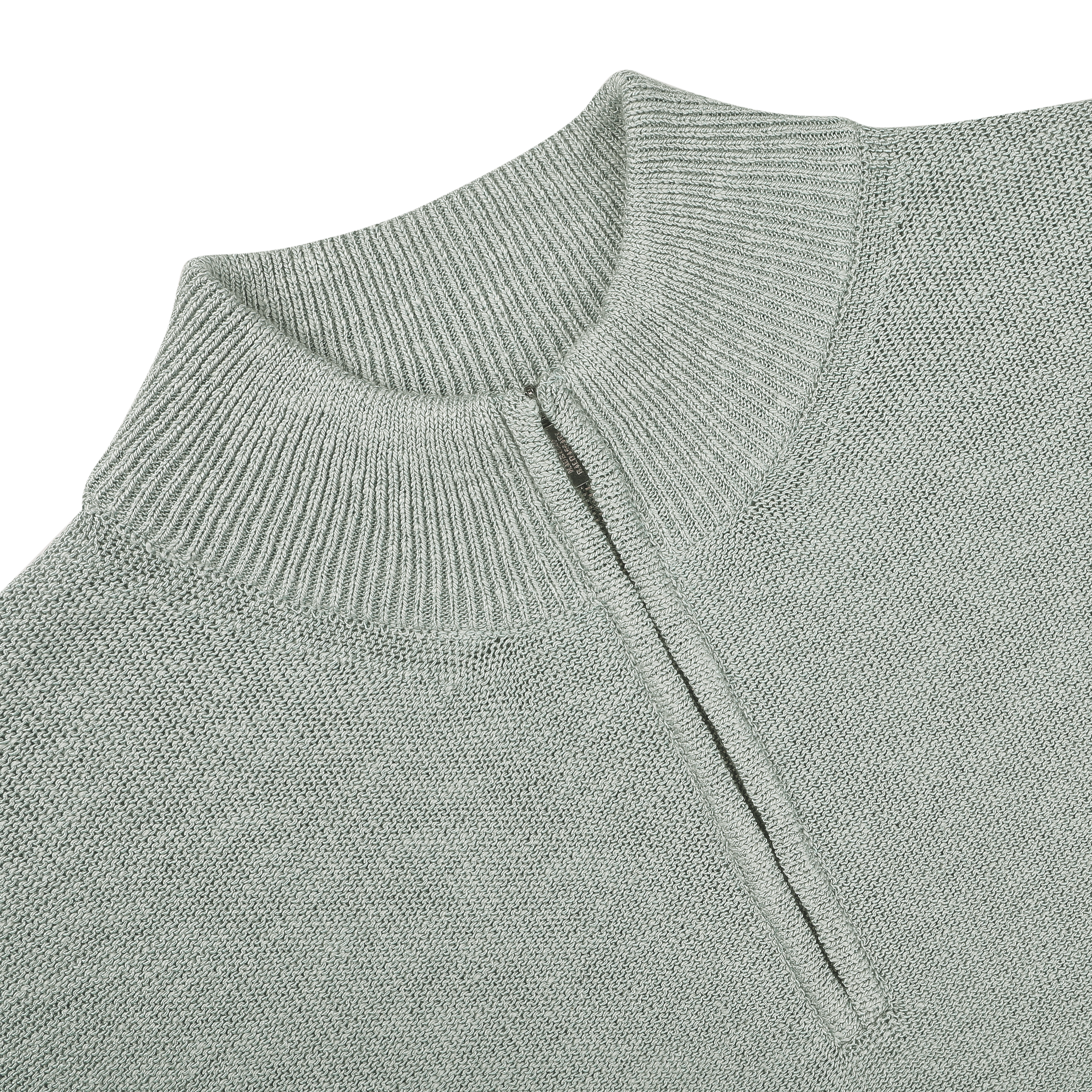 Maurizio Baldassari's Sage Green Summer Mouline 1/4 Zip Sweater features a sophisticated sage green knit with a short zipper from the collar against a black background, embodying relaxed luxury.