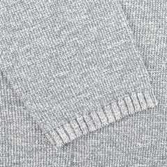 Close-up of a sleeve from the Sky Blue Summer Mouline Knitted Jacket by Maurizio Baldassari, highlighting the ribbed cuff and textured cotton-viscose blend fabric that exudes relaxed luxury.