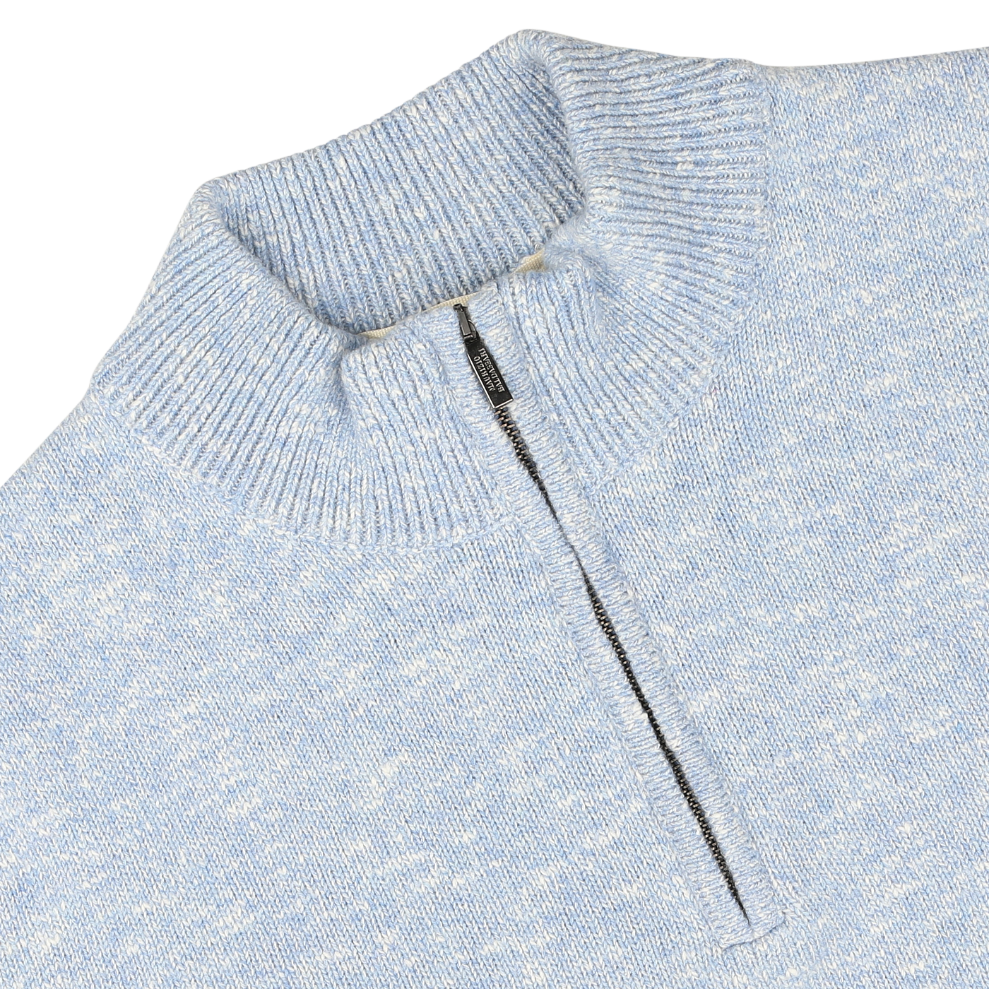 Close-up of the Sky Blue Winter Wool Mouline 1/4 Zip Sweater from Maurizio Baldassari, featuring a high collar and a 1/4-zip closure in the center. The zipper is partially open, revealing the inner Tasmanian wool fabric.