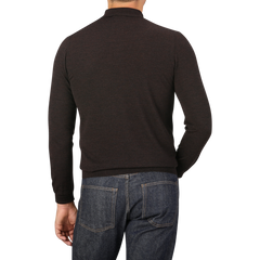 A person wearing a Mauro Ottaviani Brown Melange 16 Gauge Merino Wool Polo Shirt and jeans is shown from the back against a plain gray background.