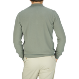 A man in a Khaki Green Supima Cotton LS Polo Shirt designed by Mauro Ottaviani.