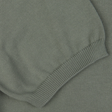 Close-up of a Mauro Ottaviani khaki green Supima cotton polo shirt with ribbed detailing.