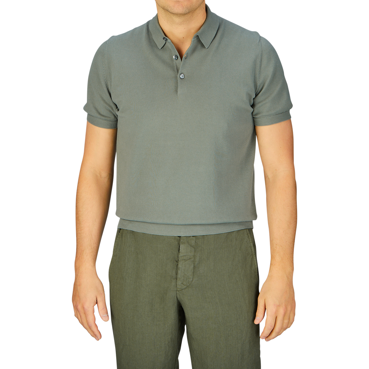 Man wearing a slim fit Mauro Ottaviani Khaki Green Supima Cotton Polo Shirt and green trousers against a gray background.