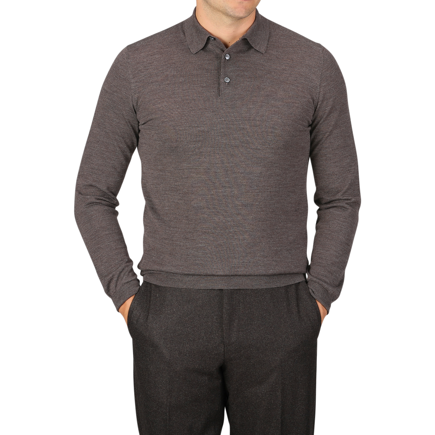 A person is wearing a long-sleeve, buttoned, light brown Mauro Ottaviani 16 gauge merino wool polo shirt and gray pants, with hands in pockets, standing against a gray background.