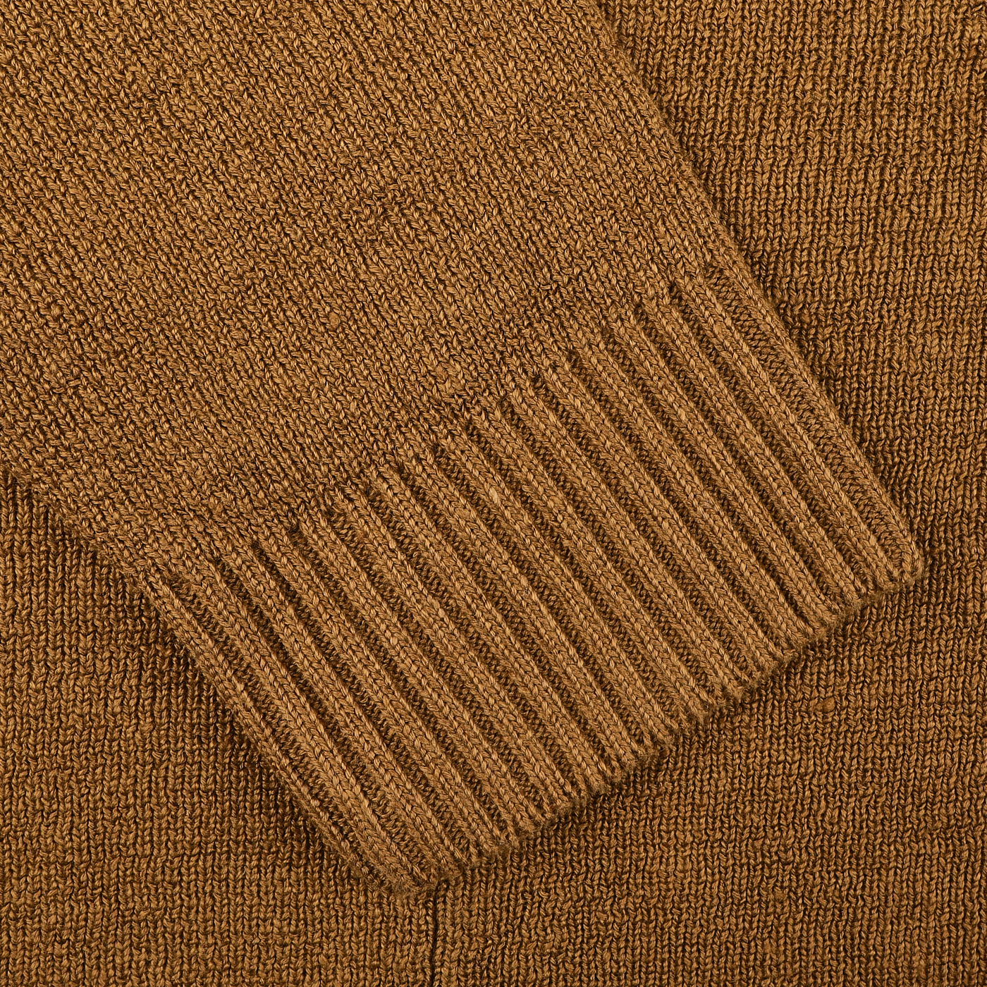 A close-up of the Tobacco Brown Linen Max 3 Chore Jacket by Max Rohr highlights the jacket's textured sleeve and ribbed cuffs, capturing its sartorial elegance.