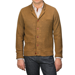 A person exudes sartorial elegance in a Tobacco Brown Linen Max 3 Chore Jacket by Max Rohr over a white shirt, perfectly paired with dark jeans.