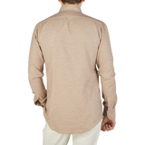 The back view of a man wearing a slim beige melange shirt from Mazzarelli, the Beige Cotton Flannel BD Slim Shirt.