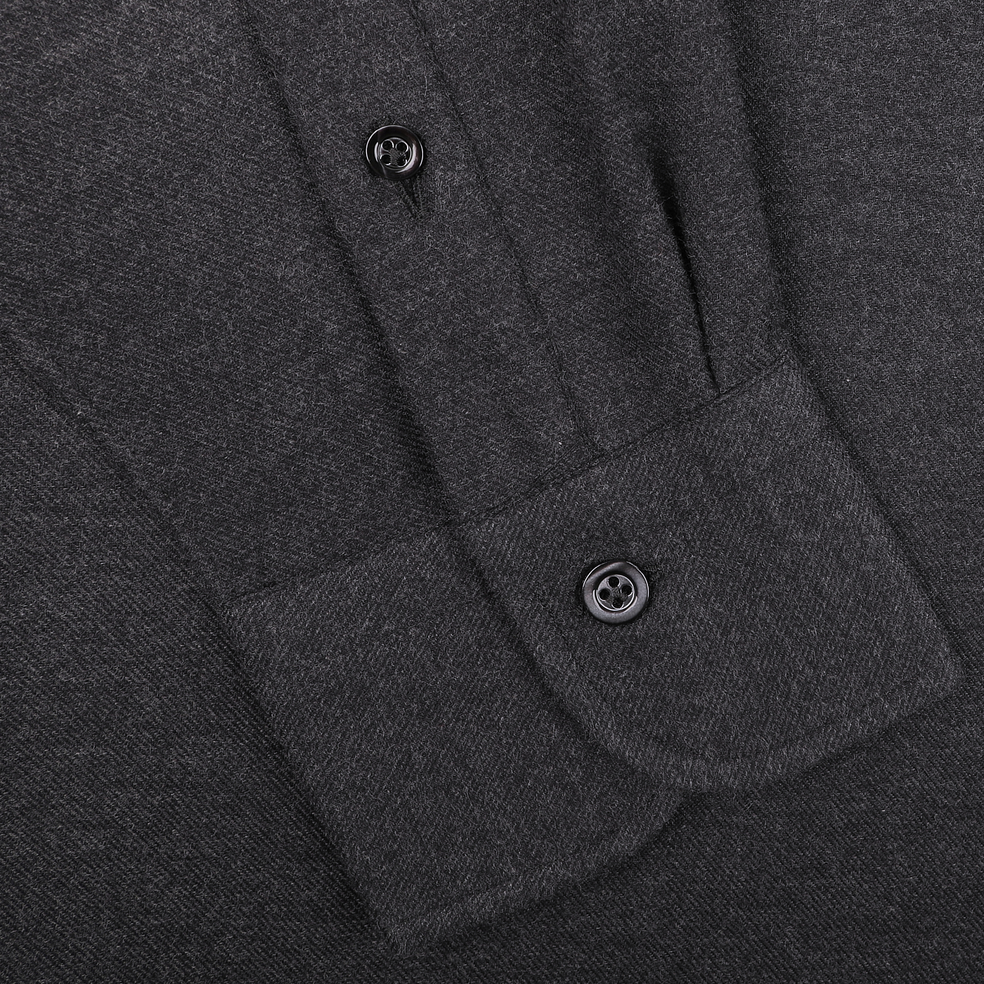 Close-up of a Mazzarelli Charcoal Grey Brushed Cotton Twill BD Slim Shirt, featuring a buttoned pocket and part of the placket with two buttons, crafted from organic cotton flannel.