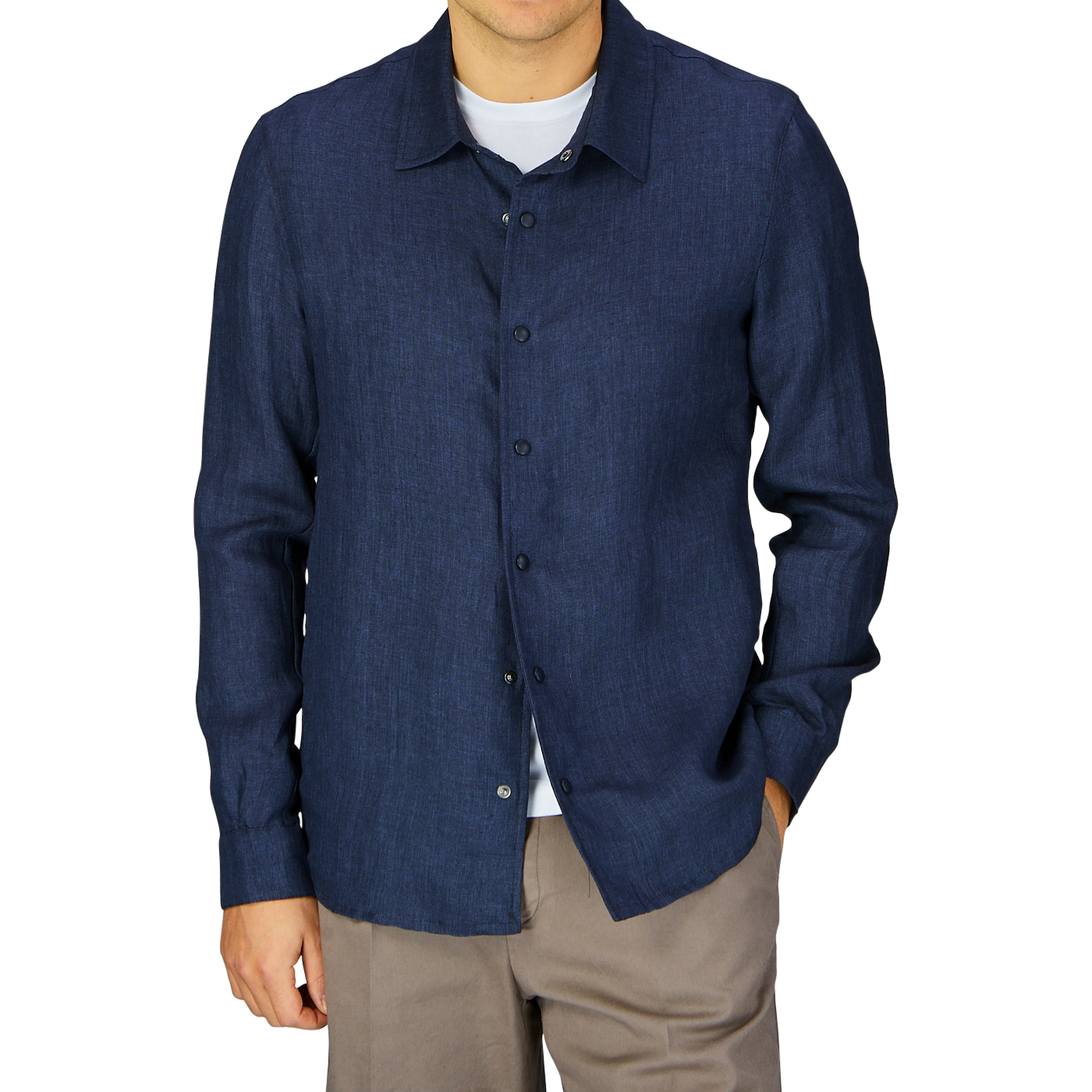 Man wearing a Mazzarelli Dark Blue Organic Linen Overshirt and beige pants, made in Italy.