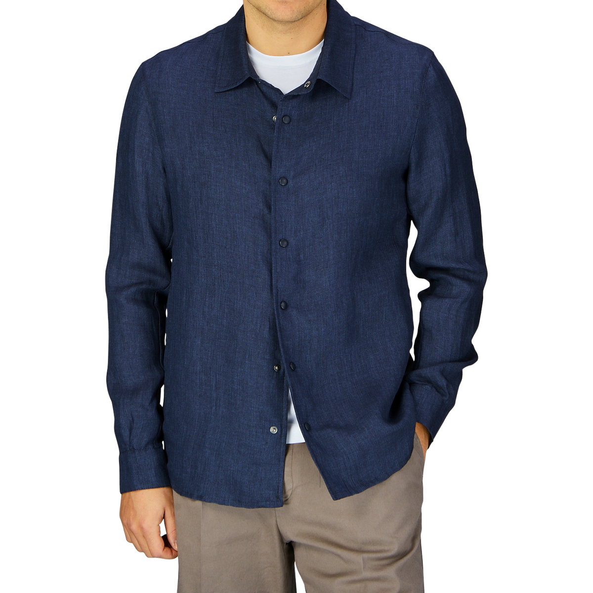 Man wearing a Mazzarelli Dark Blue Organic Linen Overshirt and beige pants, made in Italy.