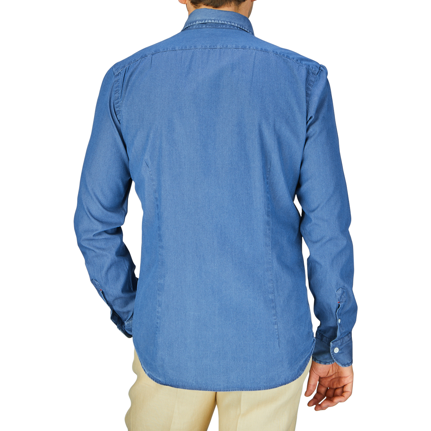 A person standing with their back to the camera, wearing a Dark Denim Washed Cotton BD Regular Fit Shirt by Mazzarelli and beige pants.