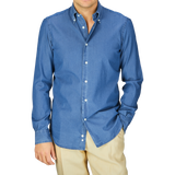 Man wearing a Dark Denim Washed Cotton BD Regular Fit Shirt by Mazzarelli and beige pants.