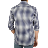 The back view of a man wearing a Grey Blue Gingham Brushed Cotton Regular Shirt, crafted by Mazzarelli.