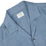 Close-up of an Indigo Blue Organic Linen Four Pocket Overshirt with a visible label reading "Mazzarelli, genuine fabrics" on the collar.