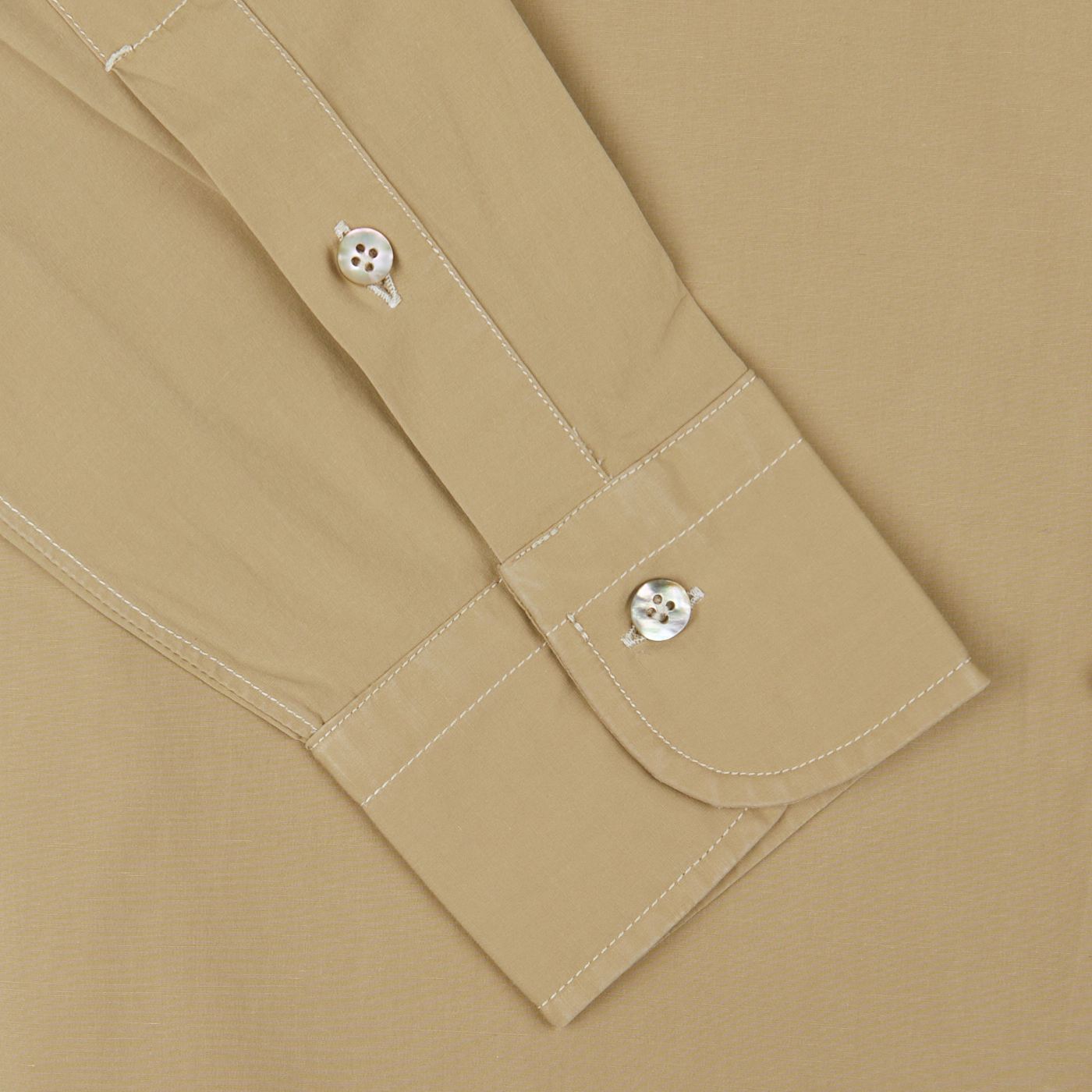 Khaki Beige Cotton Gabardine Regular Fit Shirt sleeve with decorative skull buttons on a matching background, crafted by Italian shirtmaker Mazzarelli.