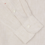 Close-up of a Light Beige Organic Linen BD Slim Shirt cuff with button by Mazzarelli.