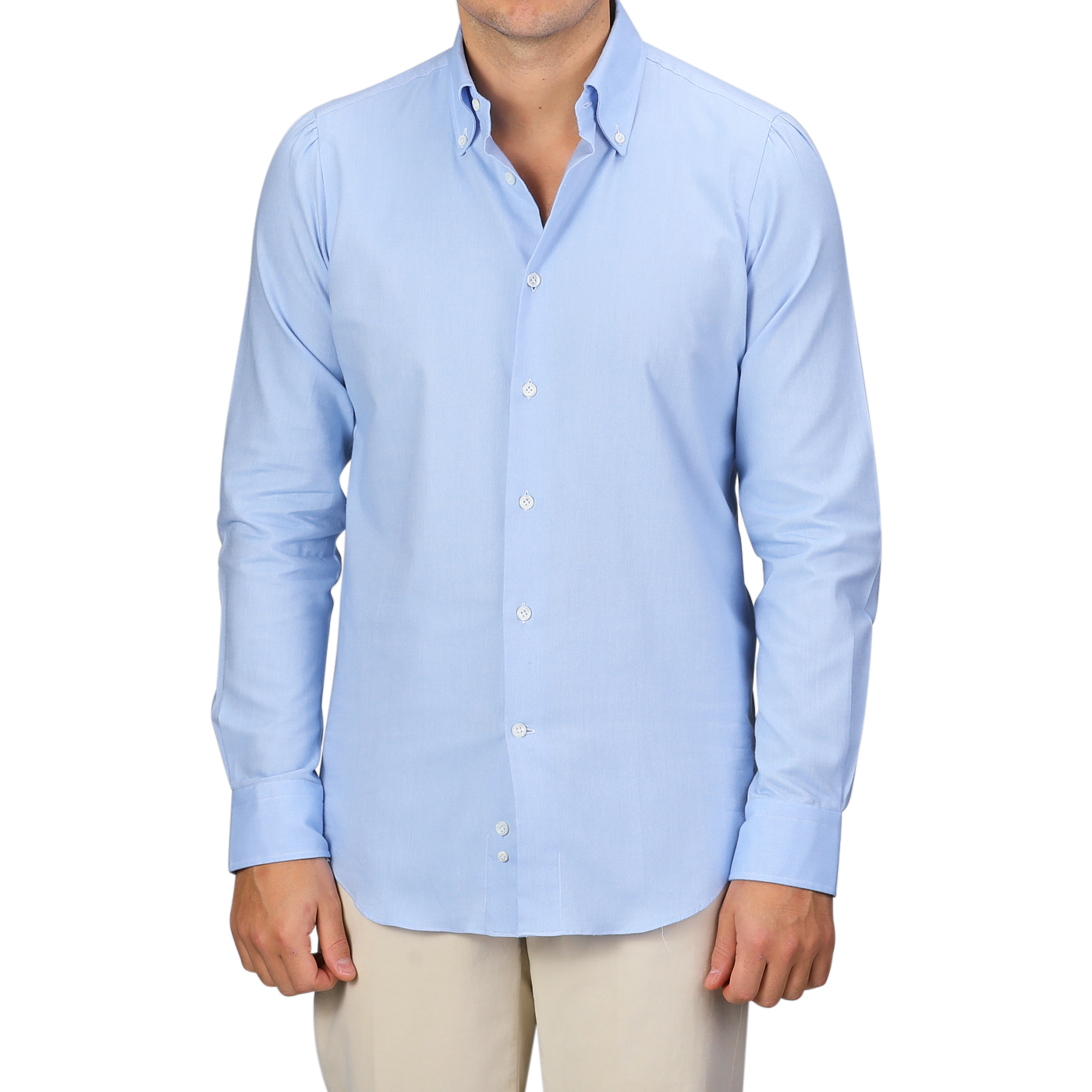 A person wearing a Mazzarelli Light Blue Brushed Cotton Twill BD Slim Shirt paired with beige pants stands against a plain background.