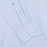 Close-up of a light blue Mazzarelli Light Blue Cotton Twill Cut Away Slim Shirt with a detailed view of buttons and sleeve placket.