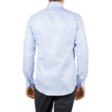 The back view of a man wearing a Mazzarelli Light Blue Houndstooth Cotton BD Slim Shirt.