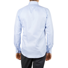 The back view of a man wearing a Mazzarelli Light Blue Houndstooth Cotton BD Slim Shirt.