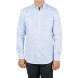 A man wearing a Mazzarelli Light Blue Houndstooth Cotton BD Slim Shirt.