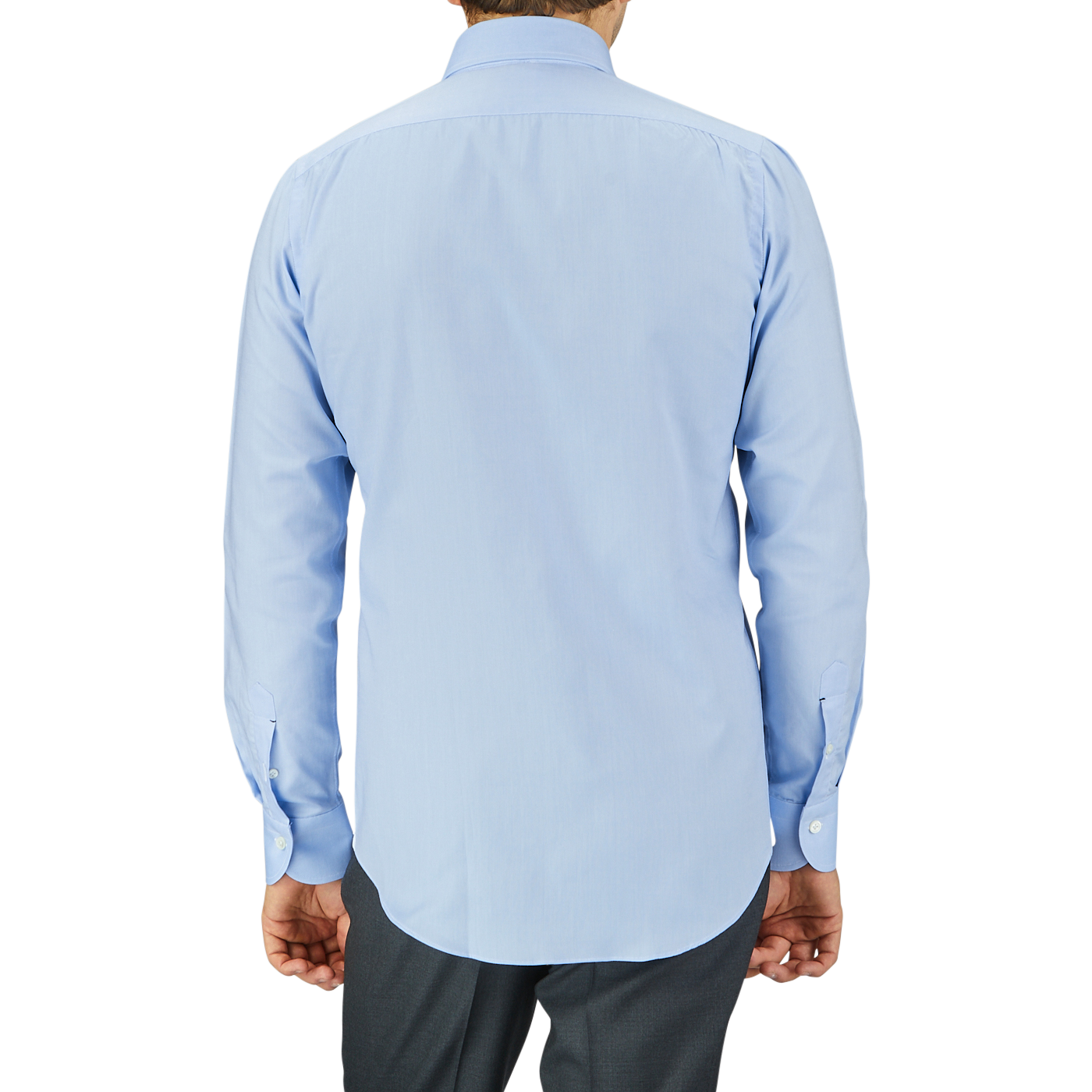 Rear view of a man wearing a Mazzarelli Light Blue Royal Oxford BD Slim Shirt and dark trousers, standing against a gray background.