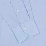 Close-up view of a Mazzarelli light blue royal oxford BD slim shirt showing detail of the cuff with two buttons and placket.