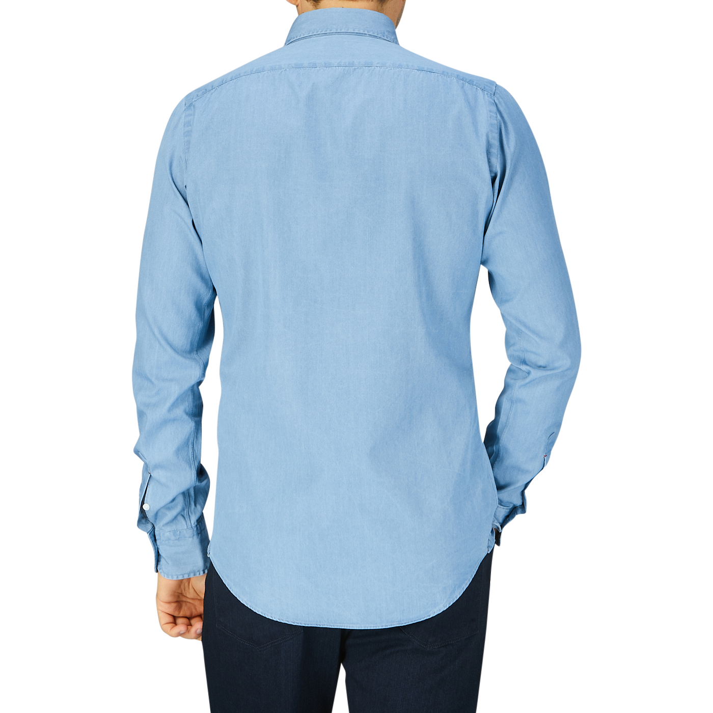 A man seen from behind, wearing a Mazzarelli Light Blue Washed Denim BD Slim Shirt and dark trousers.