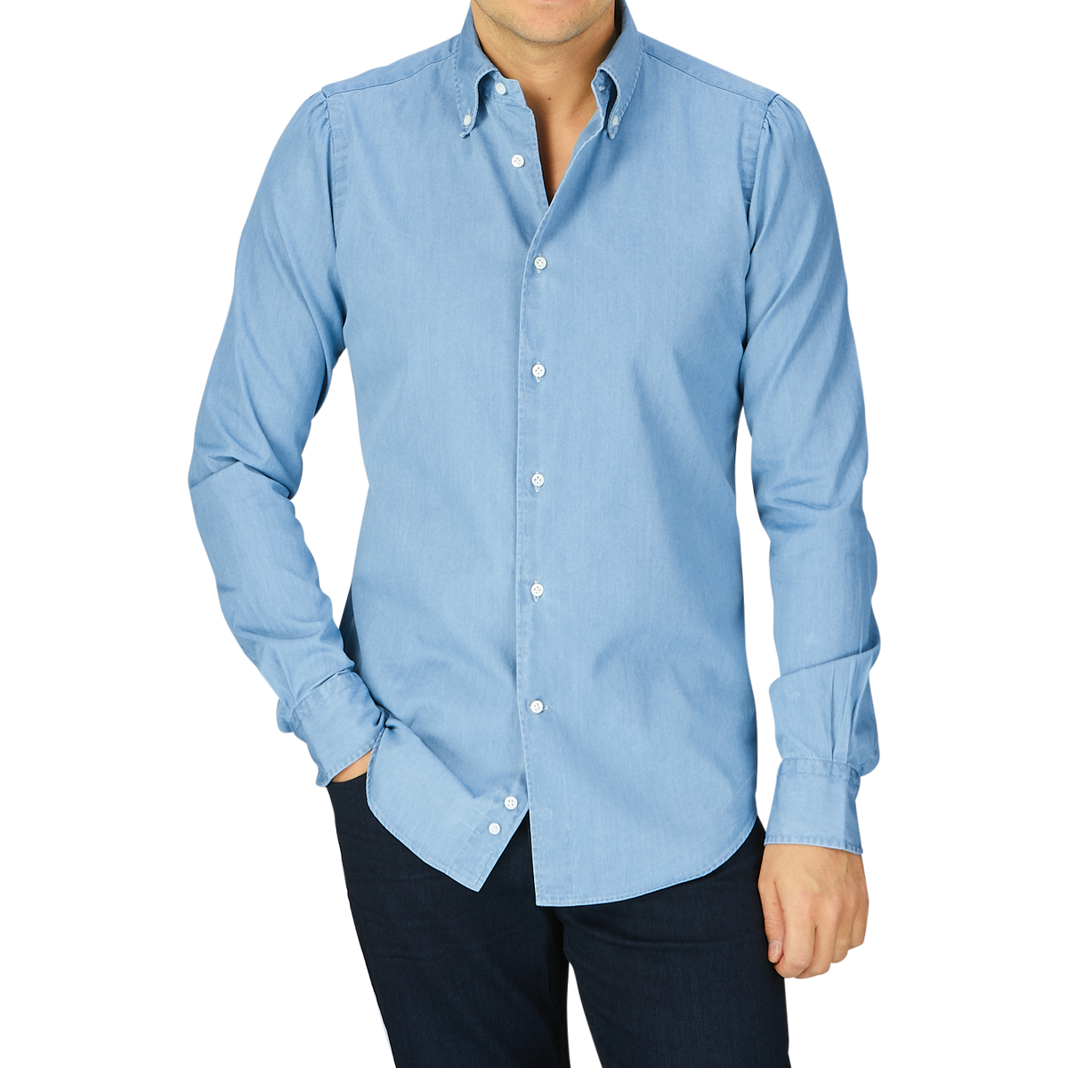 A man wearing a Mazzarelli Light Blue Washed Denim BD Slim Shirt and dark pants against a grey background.