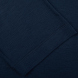 Navy blue Merino wool T-shirt with subtle texture and stitched detailing visible along the edge by Mazzarelli.