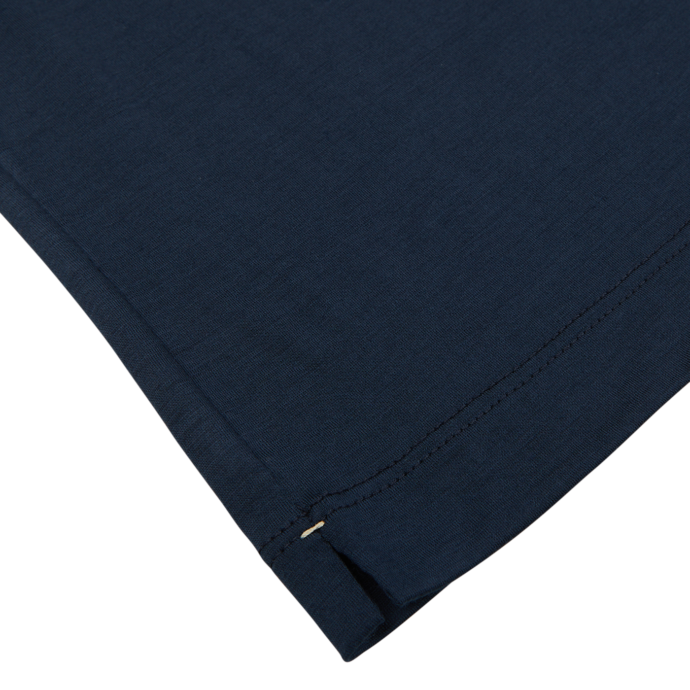 Close-up of a Mazzarelli navy blue Merino wool t-shirt with detailed stitching and a small safety pin on the edge.