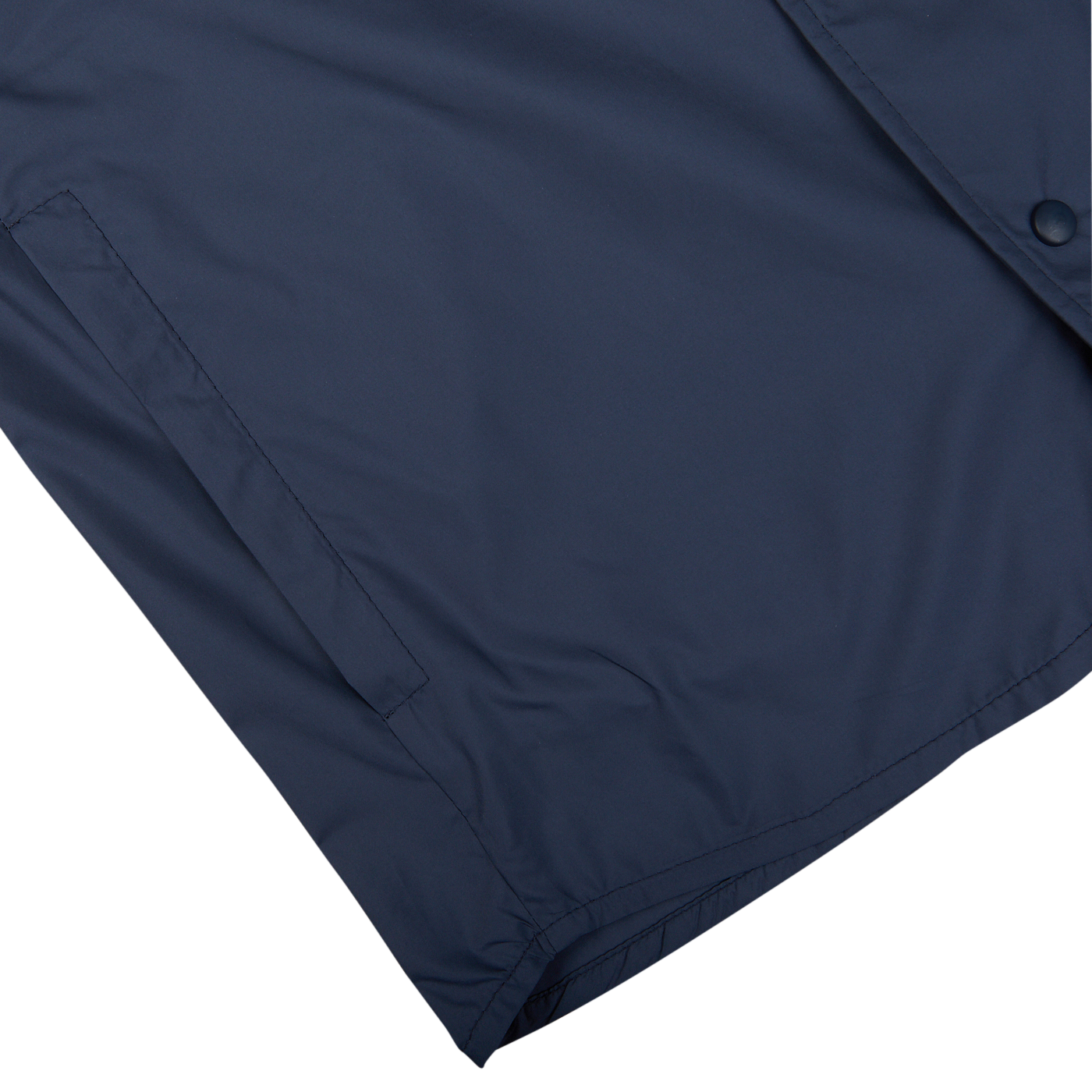 Close-up of a Mazzarelli navy blue nylon water resistant overshirt with a button and reinforced stitching on white background.
