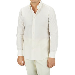 A person stands against a plain background in the Mazzarelli Off White Cotton Twill BD Slim Shirt, crafted from pure cotton twill for a refined touch.