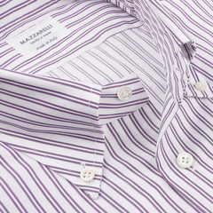 Close-up of a Mazzarelli shirt, highlighting its Purple Double Striped Cotton fabric. The elegant design includes a soft button-down collar, hand-stitched pleated shoulders, white buttons, and the label "Mazzarelli, made in Italy.