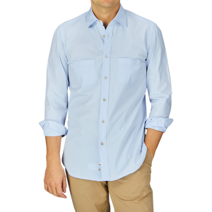 Man wearing a stone-washed, Sky Blue Cotton Gabardine Regular Fit shirt from Mazzarelli and khaki pants.