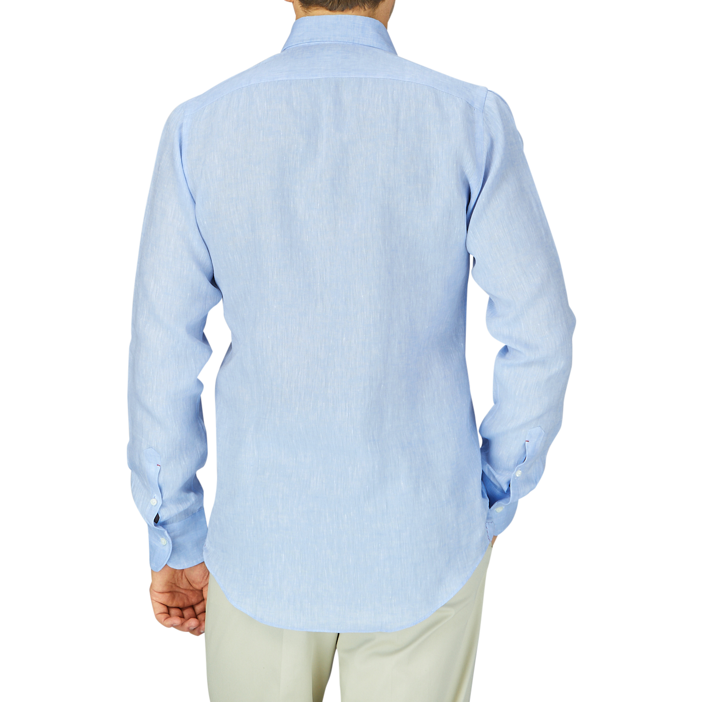 Man viewed from behind wearing a Mazzarelli Sky Blue Organic Linen BD Slim Shirt and khaki pants.