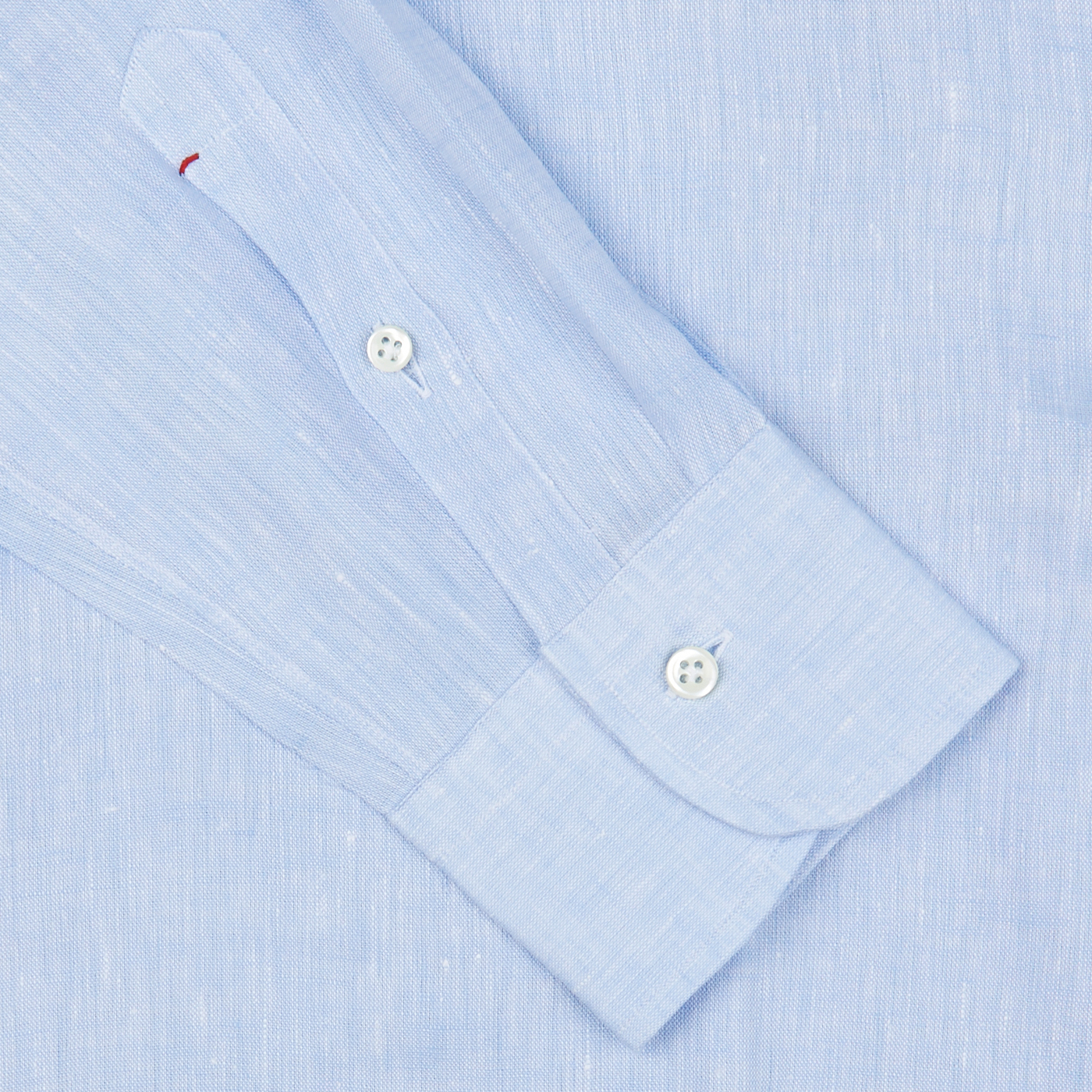 Italian shirtmaker Mazzarelli Sky Blue Organic Linen BD Slim Shirt with a close-up on the cuff and button.