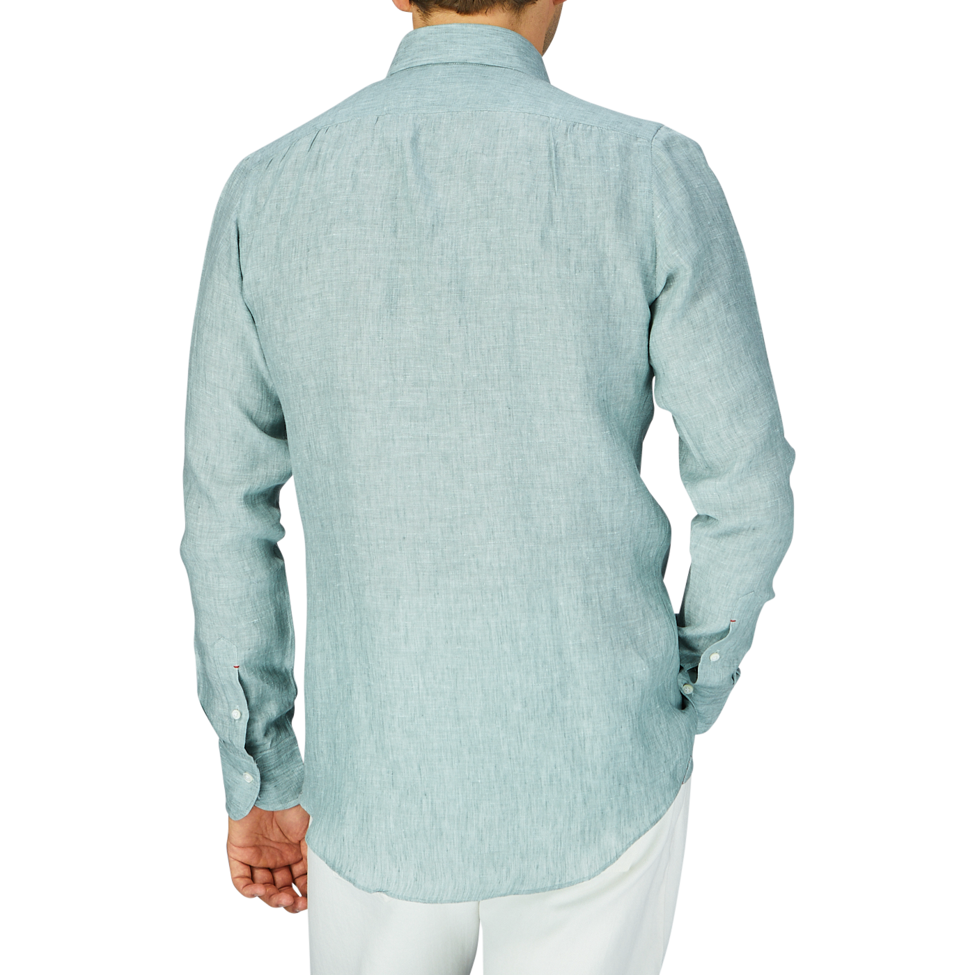 A person standing with their back to the camera, wearing a Teal Green Organic Linen BD Slim Shirt by Italian shirtmaker Mazzarelli and white pants.