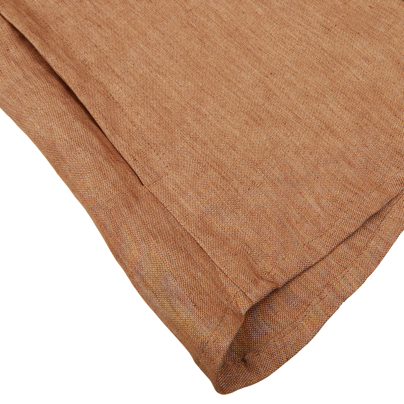 Folded tan Mazzarelli organic linen fabric napkin on white background.